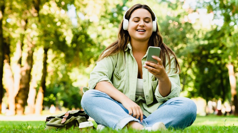 smiling woman listening to music