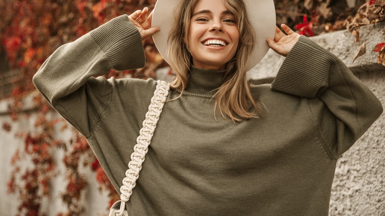 Woman wearing gray sweater