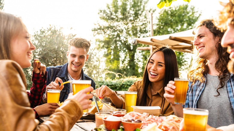 friends drinking beer outside 