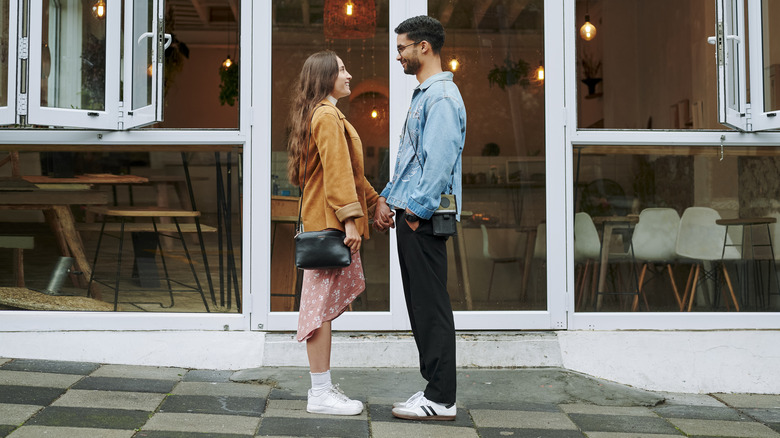 man and woman staring at each other