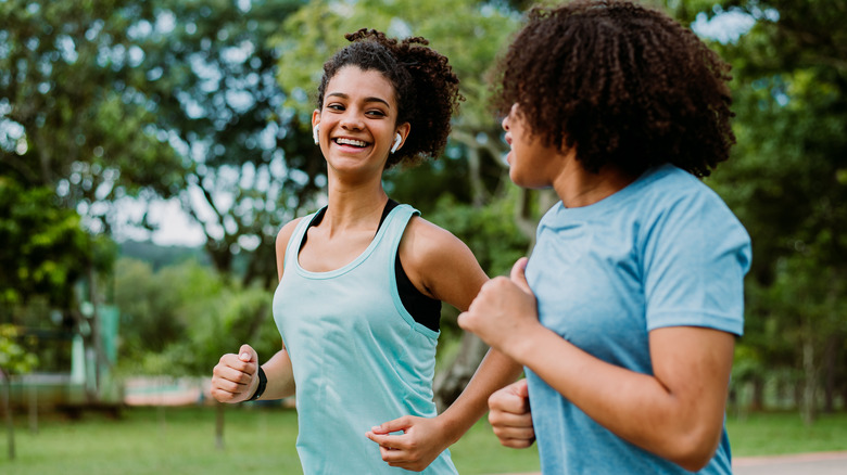 Women jog together
