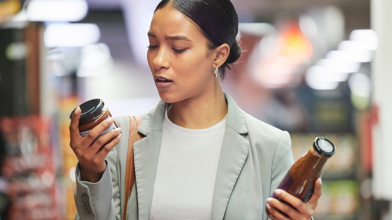 Shopper checking food labels