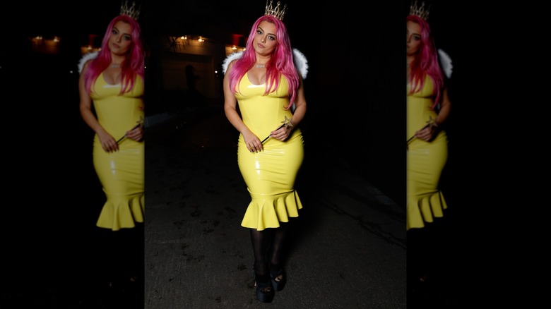 Bebe Rexha's 2025 Halloween costume consisting of a yellow dress, wings, and a pink wig