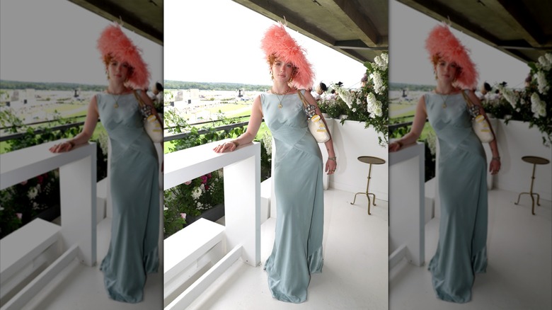 Talitha Howden at Royal Ascot 2026 on a blue dress and pink hatinator.