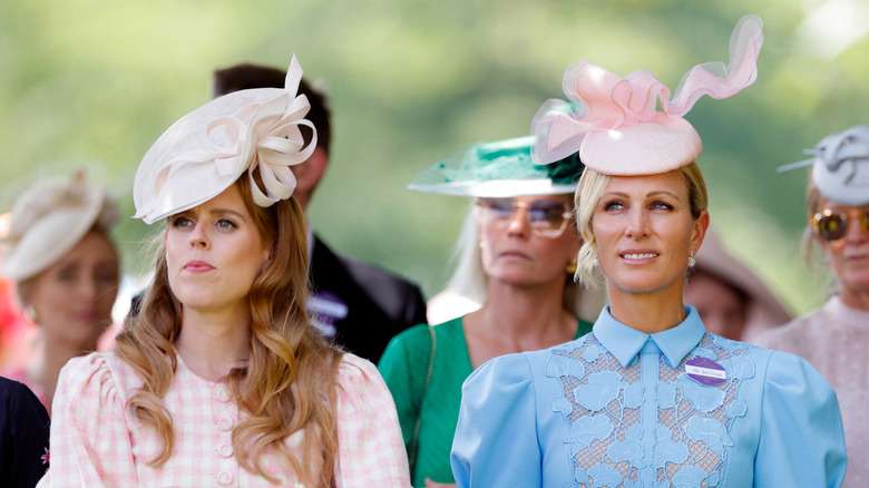 Princess Beatrice stands with Zara Tindall at the Royal Ascot