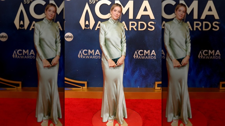 Hayley Hubbard in light green satin dress