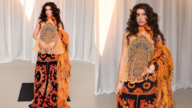 Odessa A'zion wearing an orange-and-black outfit at the 2026 Academy Museum Gala