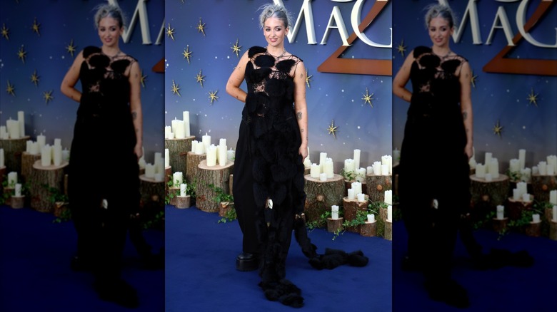 Harriet Rose wearing a cloak at the Practical Magic 2 premiere red carpet