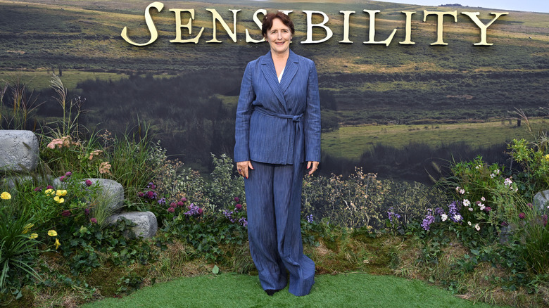 Fiona Shaw wearing a blue suit at the "Sense and Sensibility" red carpet
