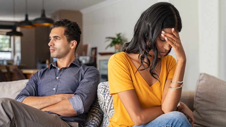 Unhappy couple on couch