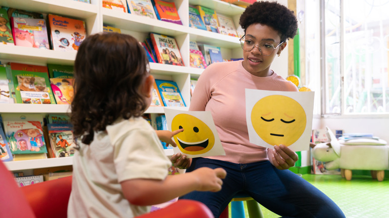 Teacher helping child express emotions