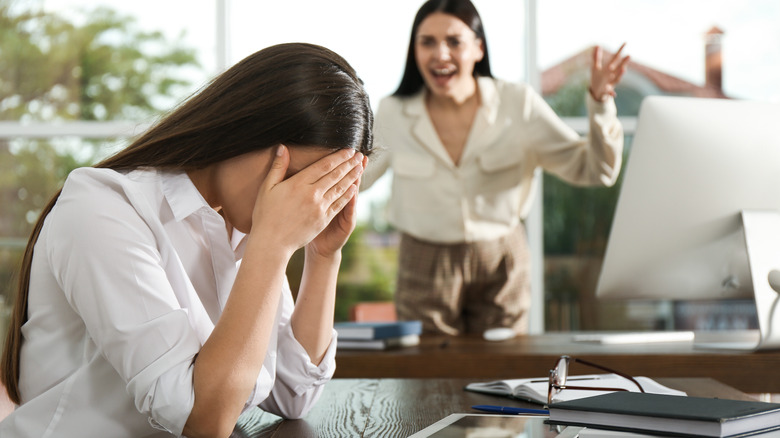 Woman yelling at another woman