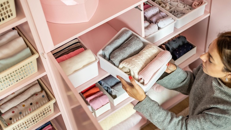 Woman organizing closet