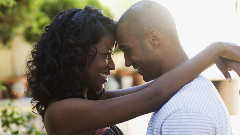 Couple smiling and embracing