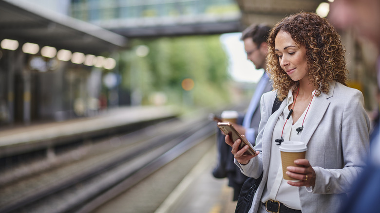 Woman smirks at phone