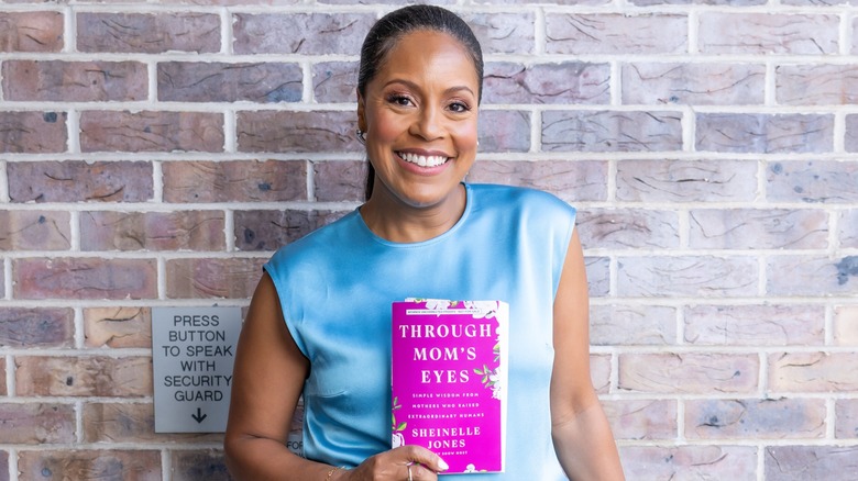 Sheinelle Jones poses with her book 