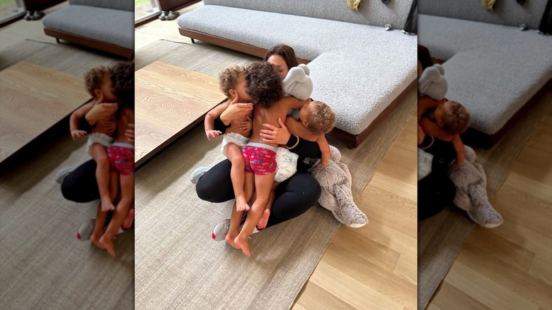 Ashley Graham hugging her three boys: Isaac, Roman, and Malachi