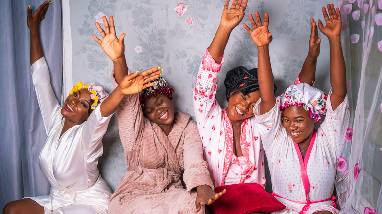 happy women with hair caps smiling