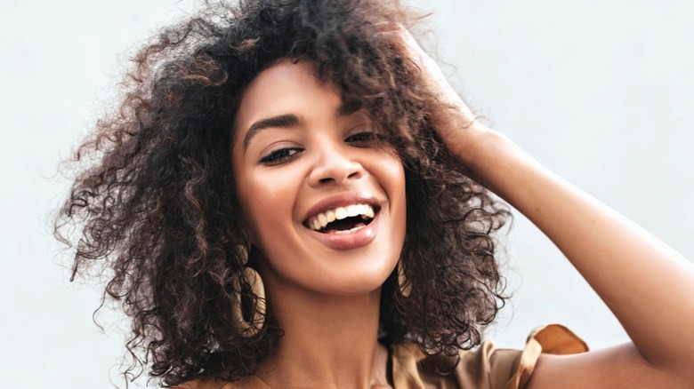 smiling black woman with curly hair
