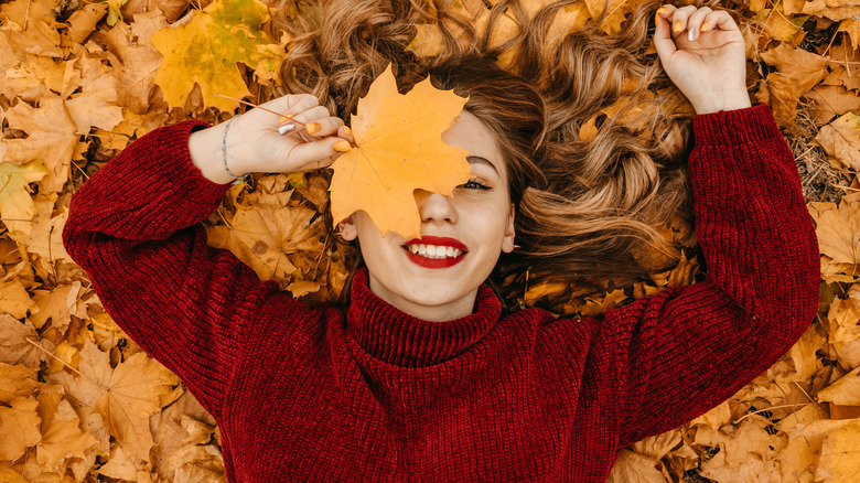 woman autumn leaves hair