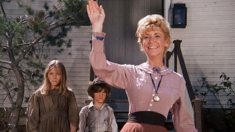 Mary Ingalls pictured holding Baby Grace Ingalls with Miss Beadle on 