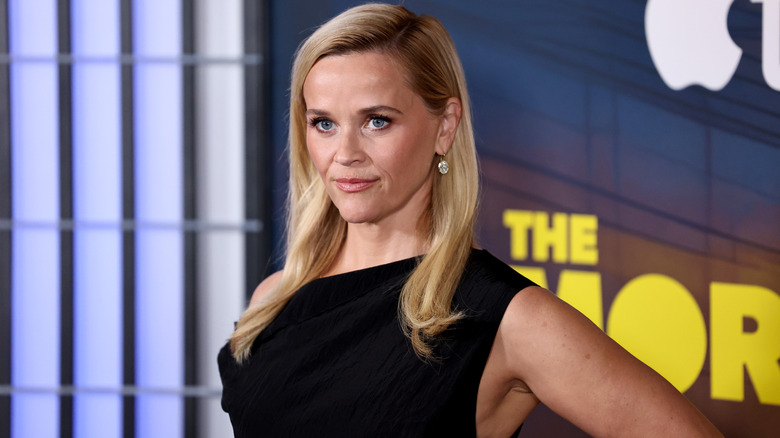 Reese Witherspoon poses on a red carpet