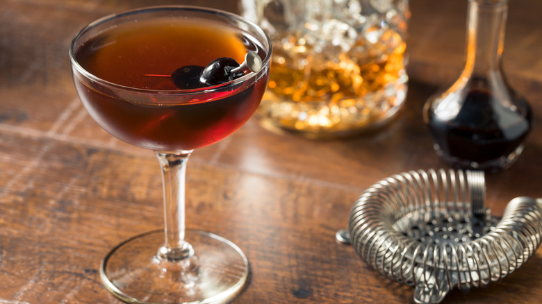 whiskey cocktail with cherries