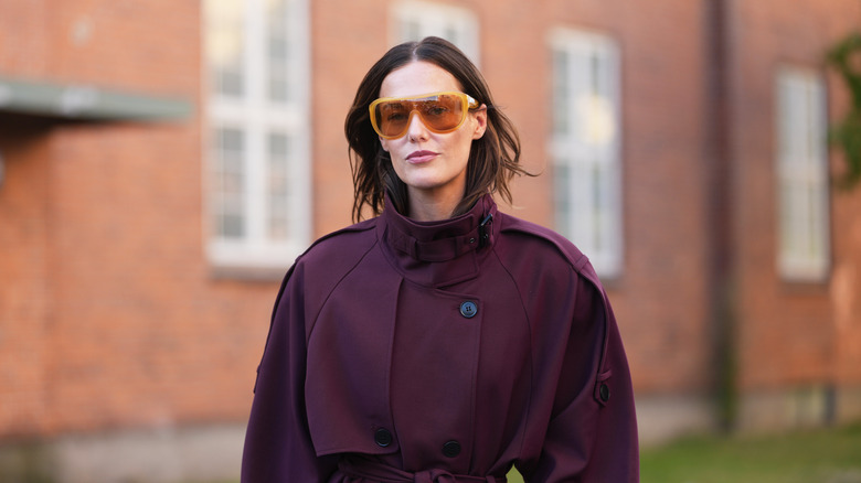 Woman wearing burgundy jacket