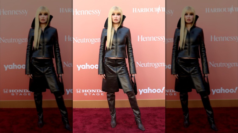 Kim Petras wears black leather boots and a matching skirt to the 2026 Billboard Women in Music Event.