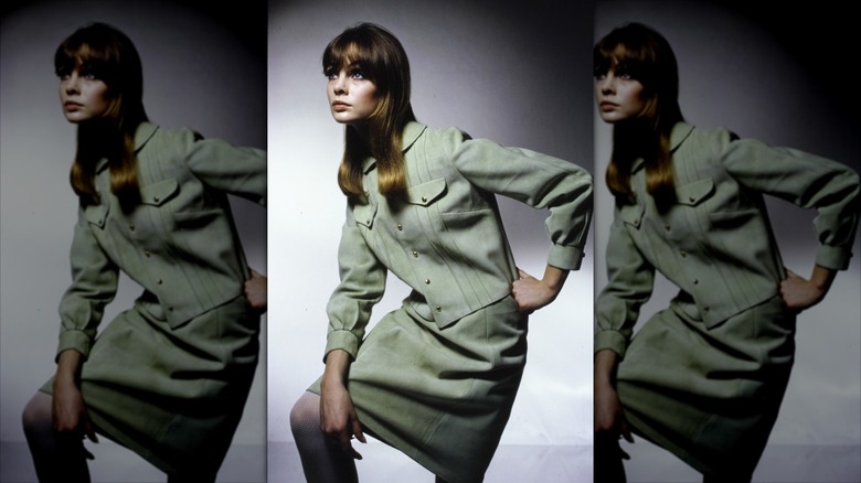 Jean Shrimpton poses wearing a sage green skirt suit coordinate