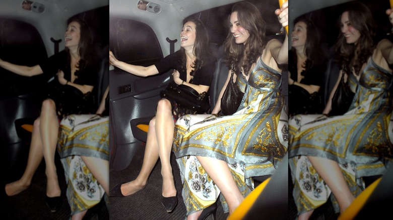 Kate Middleton in a silky patterned dress with her sister Pippa Middleton