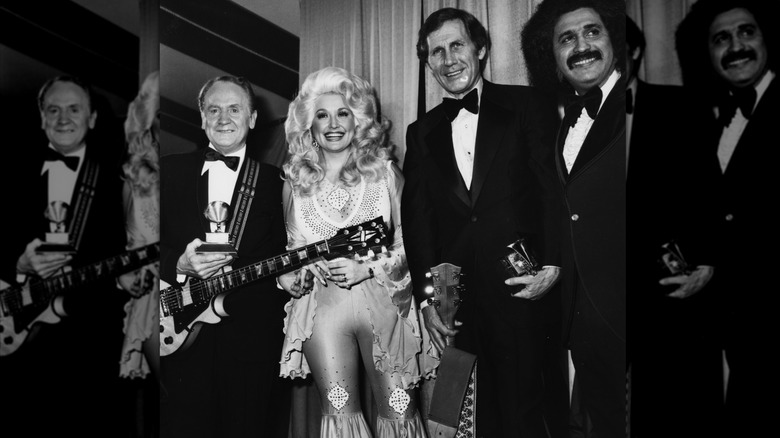 Dolly Parton attending the 1977 Grammy Awards wearing a pink bell bottom jumpsuit.