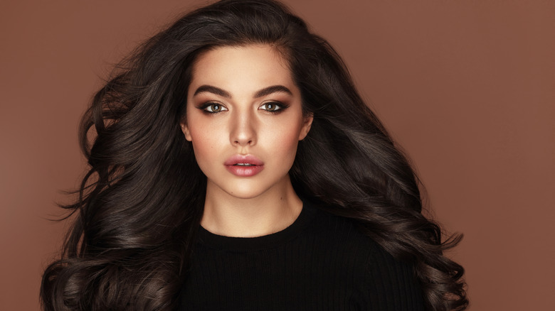 woman with brunette large voluminous hair