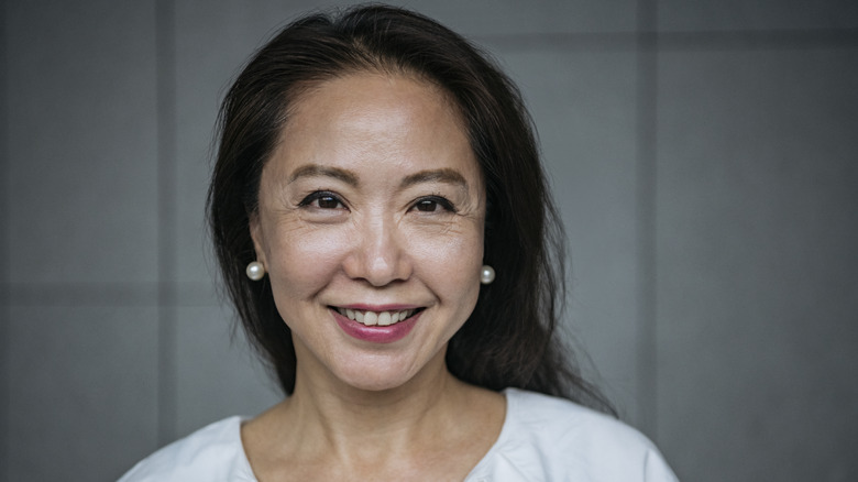 older woman smiling at camera 