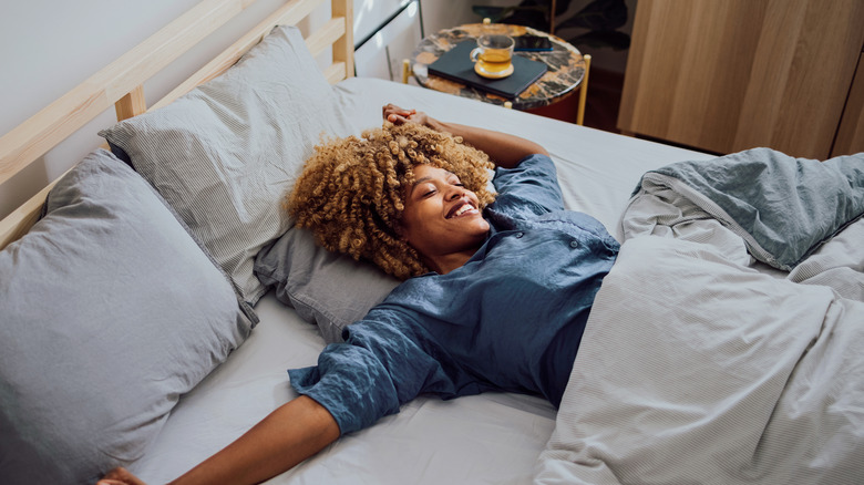 Smiling woman in bed