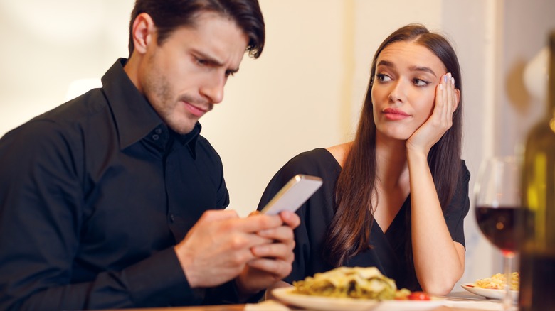 Woman glaring at man