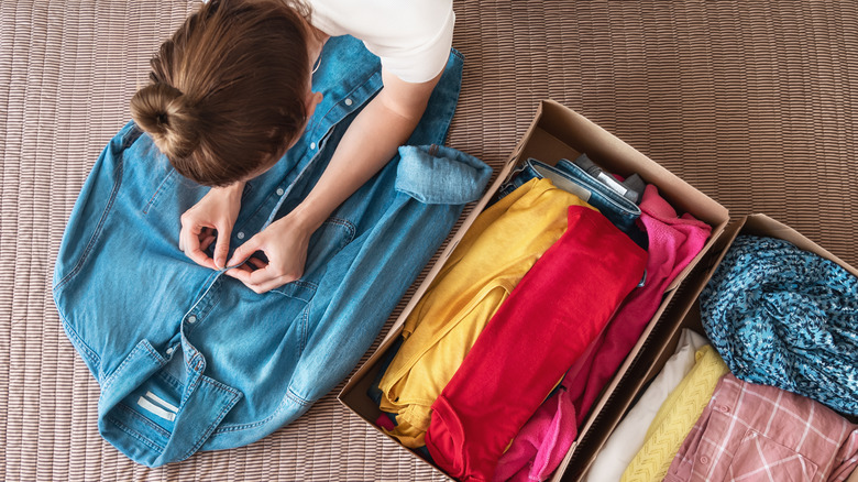 woman with boxed clothing