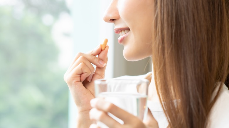 Woman taking supplements