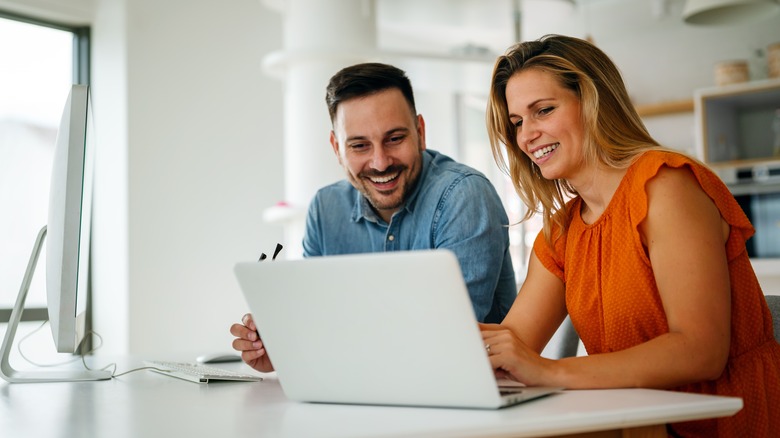 two people looking at computer