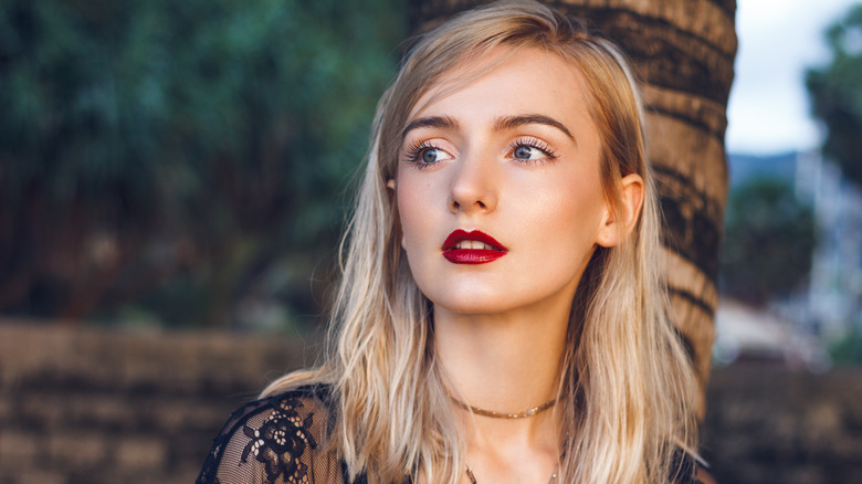 Woman wearing flawless red lipstick 