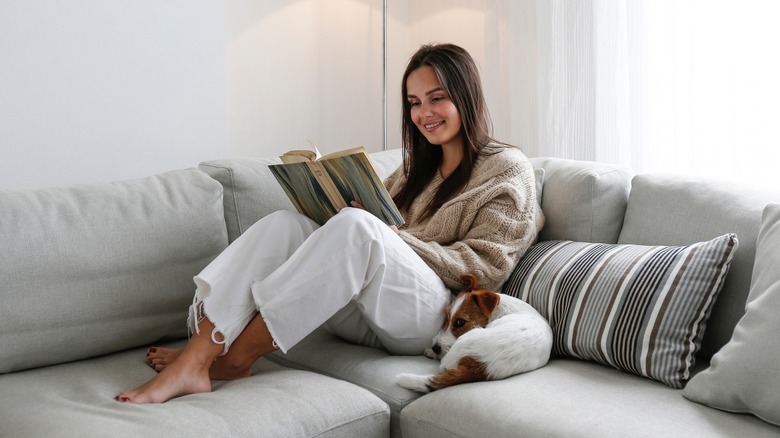 smiling woman reading at home