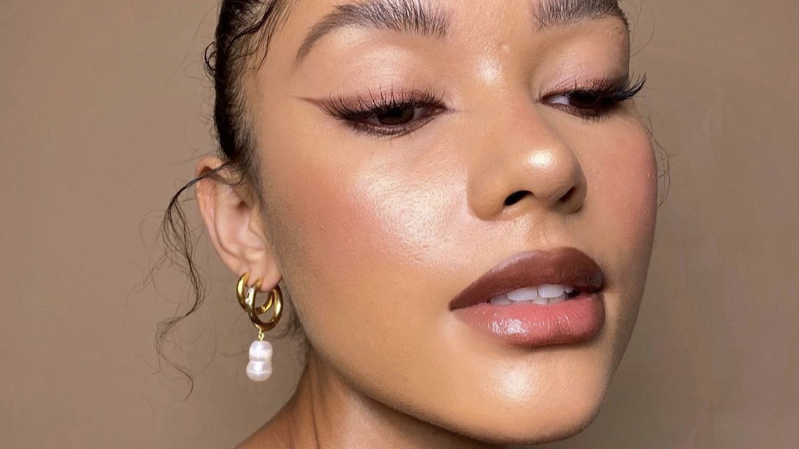 TikTok's Newest Eyeliner Trend Is A Sleek Reimagining Of The Siren Eyes