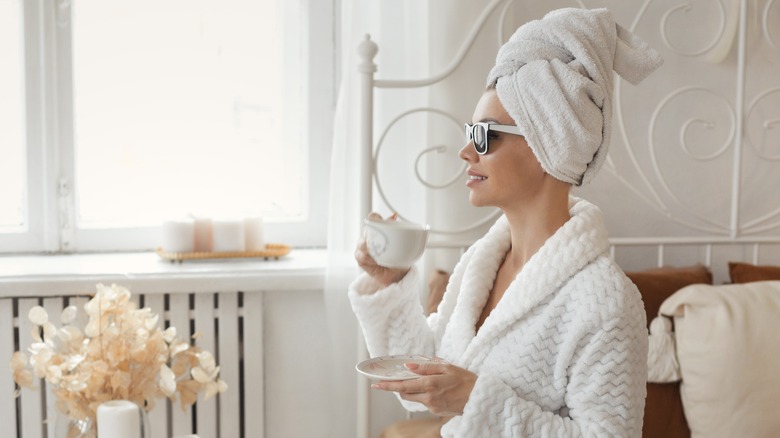 Woman out of the shower in white towel 