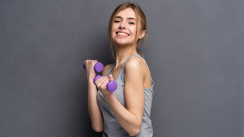 Girl holding weights