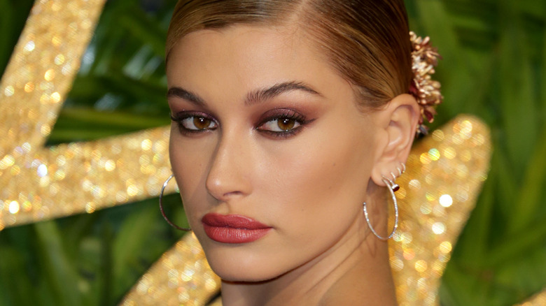 Hailey Bieber posing with lifted smokey eye