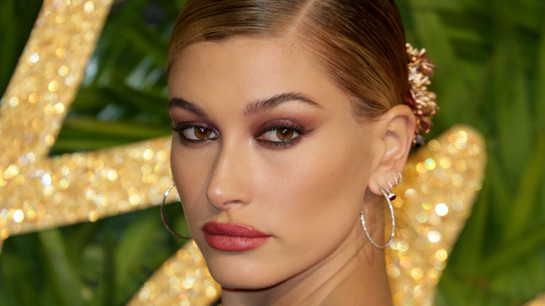 Hailey Bieber posing with lifted smokey eye