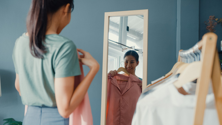 Woman picking outfits