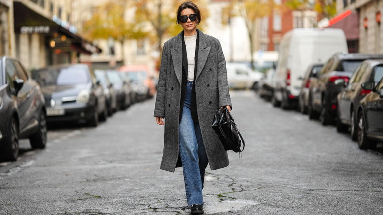 woman in coat and jeans