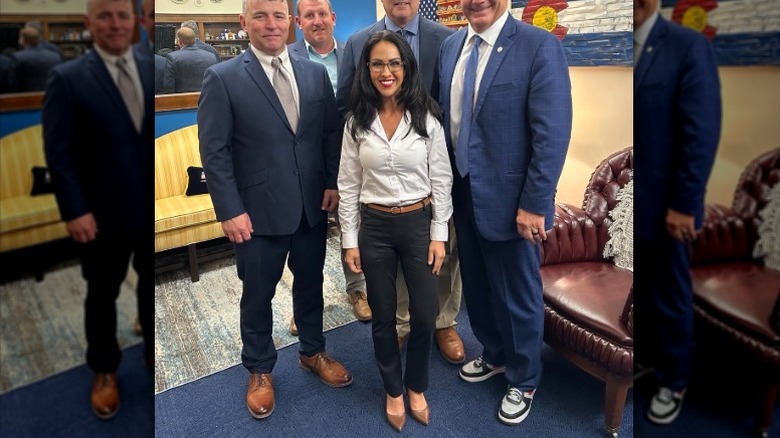 Lauren Boebert poses for a photo in her office