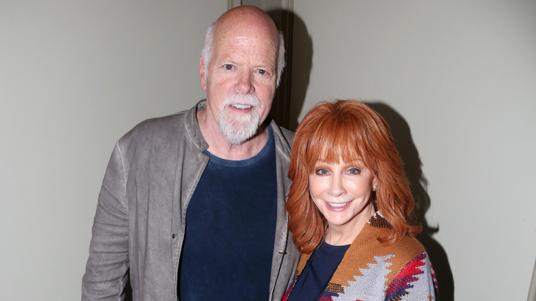 Reba McEntire and Rex Linn posing together